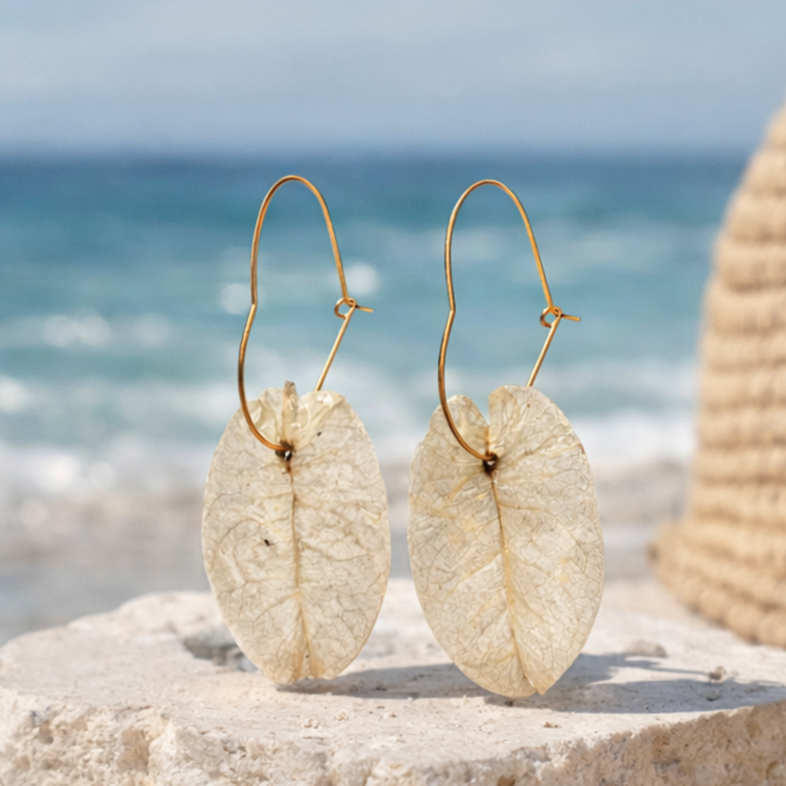 Ibiza Bridal earrings on a beach with ocean view